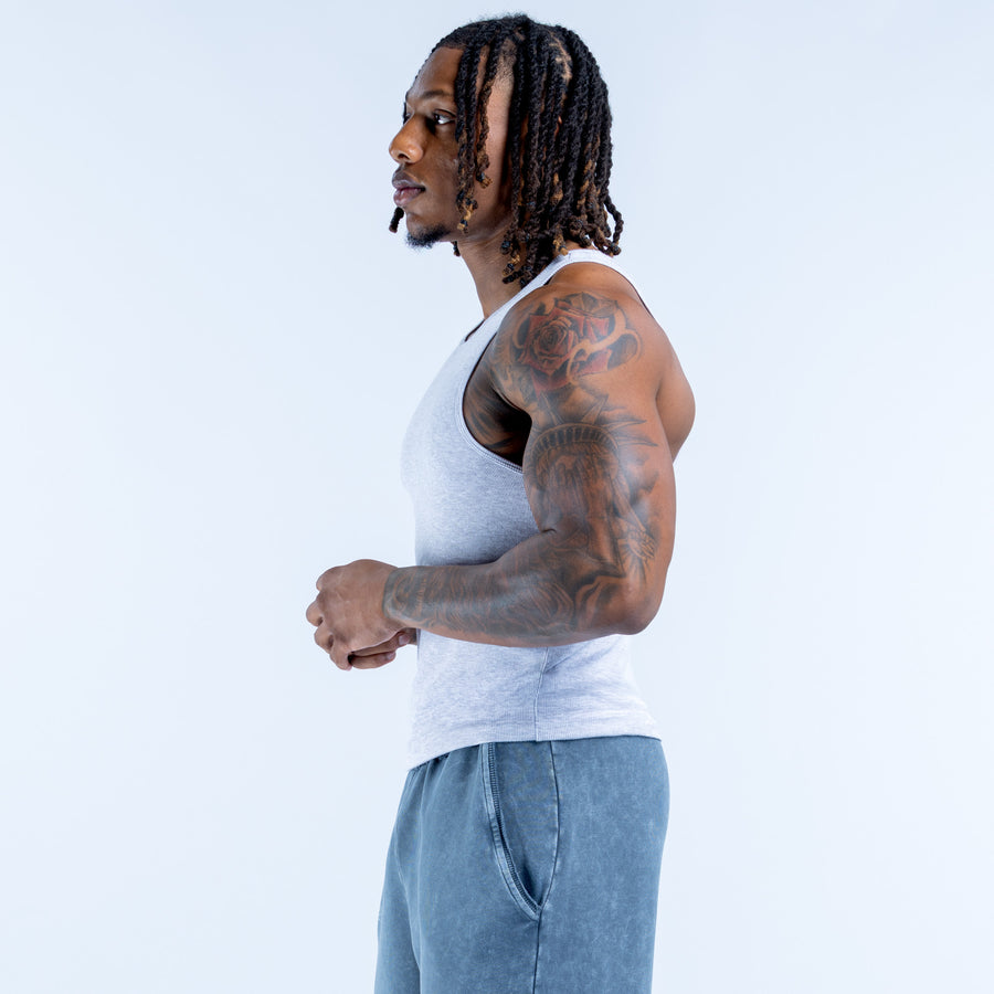 Light blue ribbed sleeveless vest, crew neck, side profile view
