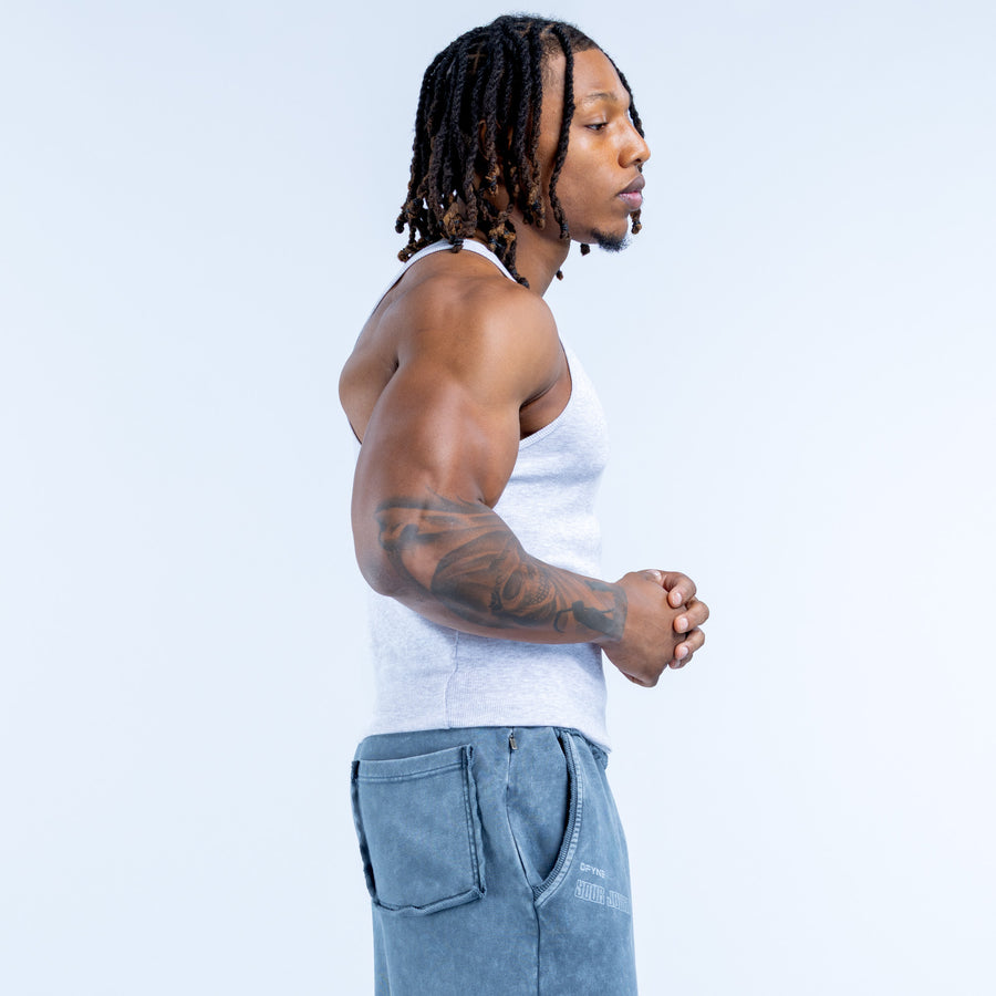 Light blue ribbed sleeveless vest, crew neck, angled side view