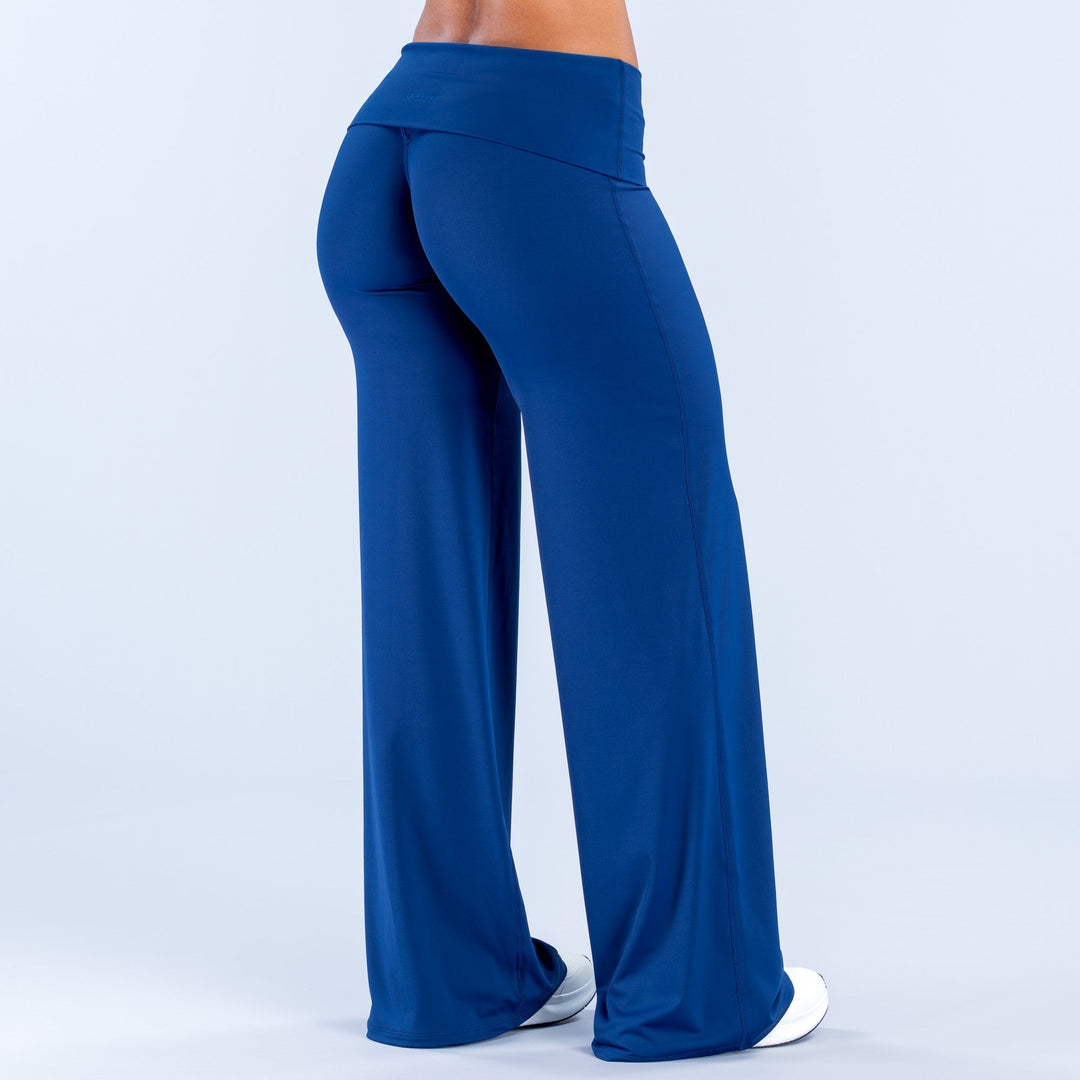 Blue fold-over wide-leg pants, back view with wide flared legs and seam