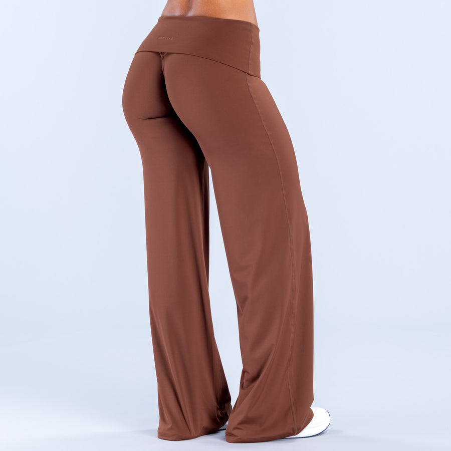 Fold-over wide-leg pants in rust brown, back view with waistband seam detail