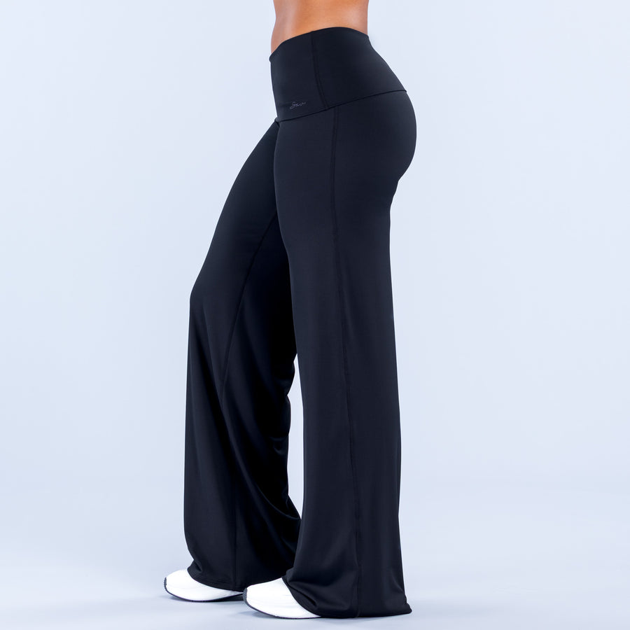 Fold-over wide leg pants in dark color, side view with smooth drape and wide hems