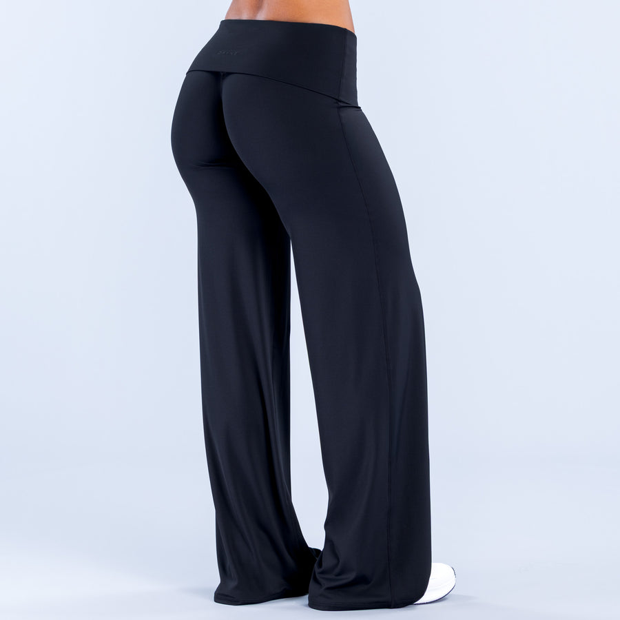 Fold-over wide leg pants in dark color, back view with wide leg opening