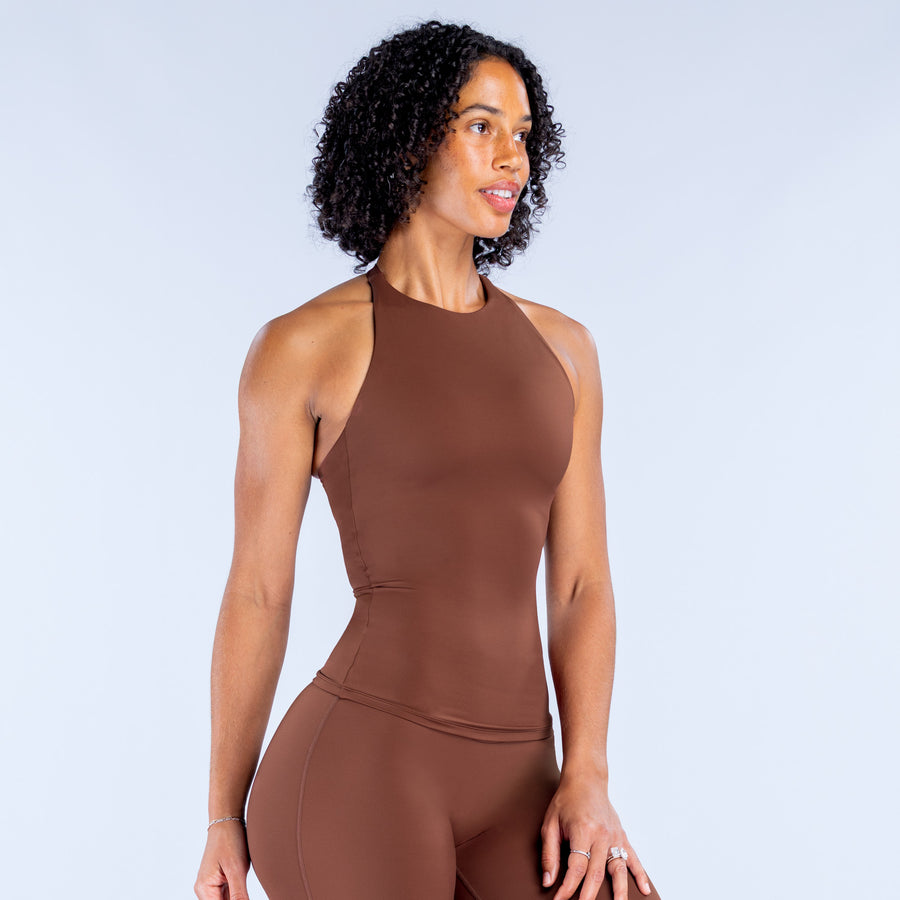 Brown longline halter top with high neck and curved waist seam, front view