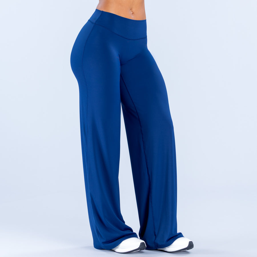 Blue wide-leg pants with high rise, smooth fit through hip, wide flowing legs