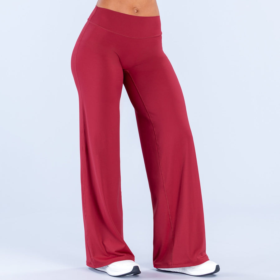 Red wide-leg pants with high waist and straight-to-flare silhouette