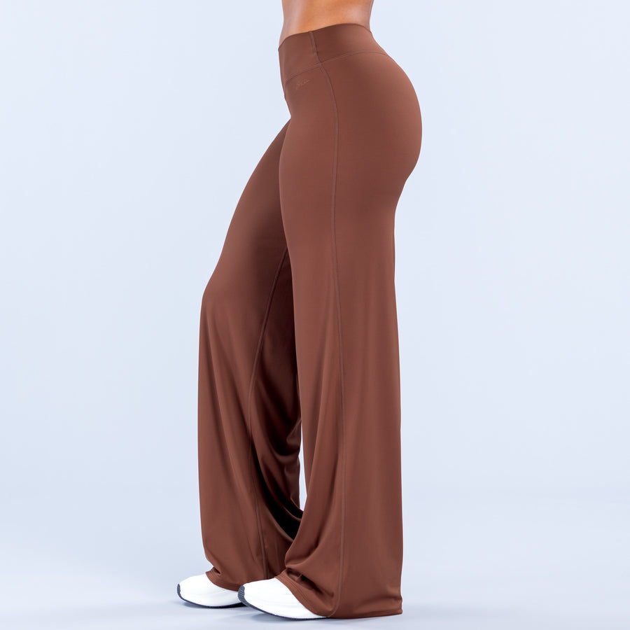 Brown wide-leg pants, side view, smooth fabric and full-length drape