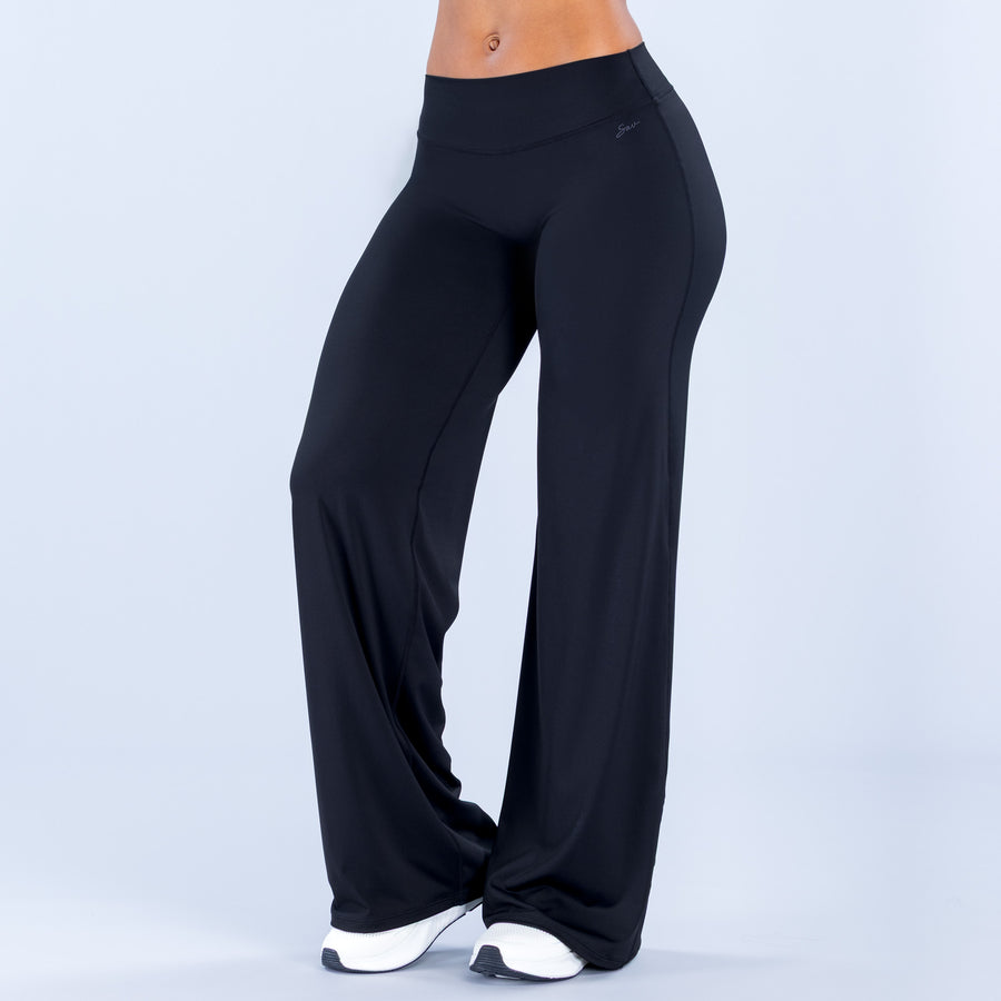Wide leg pants in dark color, high-rise waistband and flared straight-leg silhouette