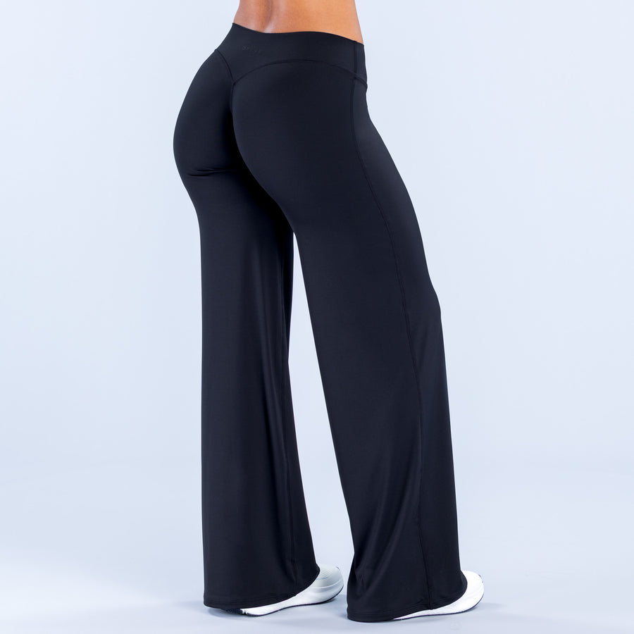 Wide leg pants in dark color, smooth high-rise fit with wide flaring legs