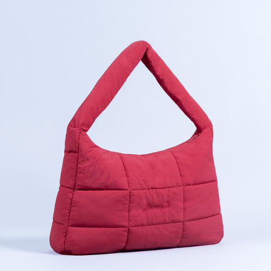 Red puffer tote bag with padded handle and quilted panels