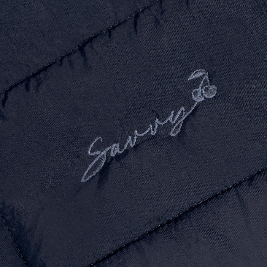 Sav puffer bag embroidered script logo on quilted dark fabric