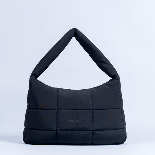 Sav puffer bag in dark navy with open top shape and horizontal quilting