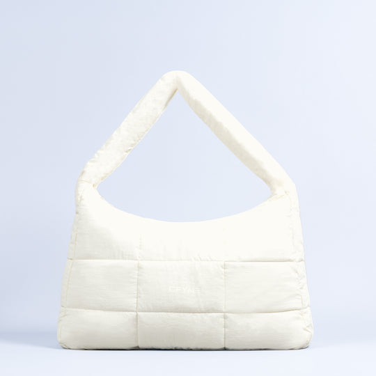Sav puffer bag in off-white with quilted panels and wide top handle