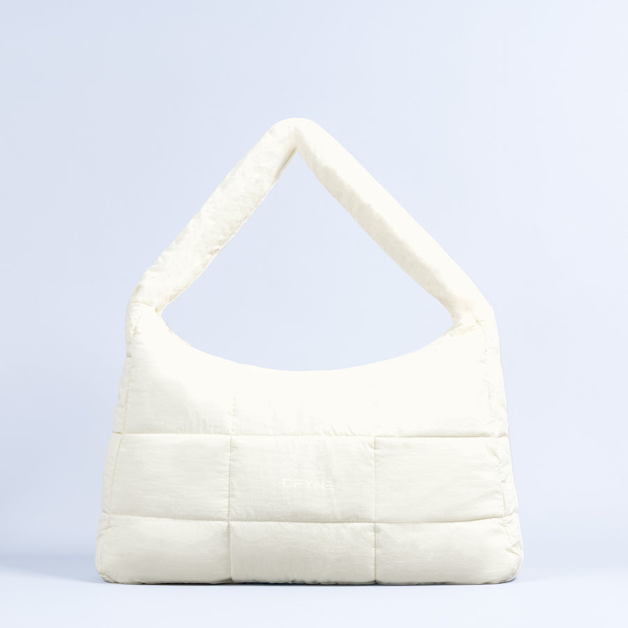 Sav puffer bag in off-white with quilted panels and wide top handle