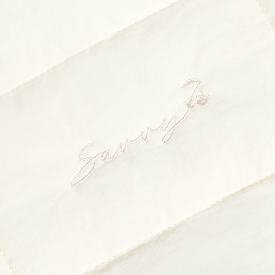Sav puffer bag with embroidered script logo on off-white quilted panel