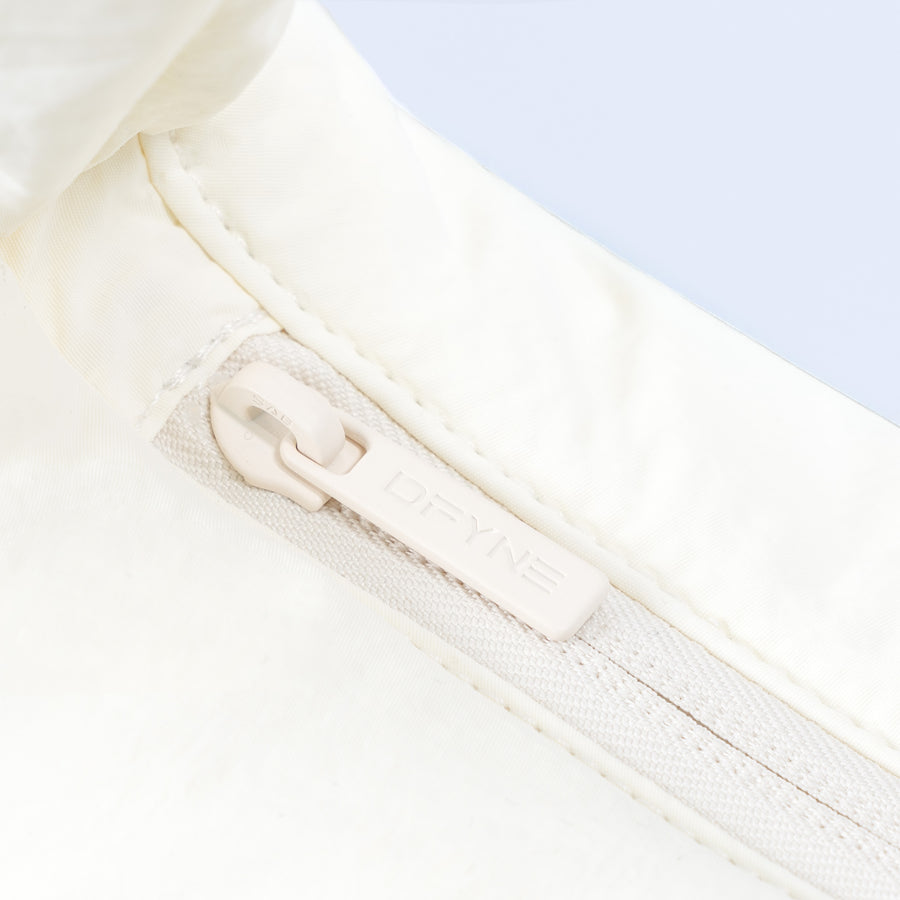 Sav puffer bag: off-white zip pocket and padded strap detail