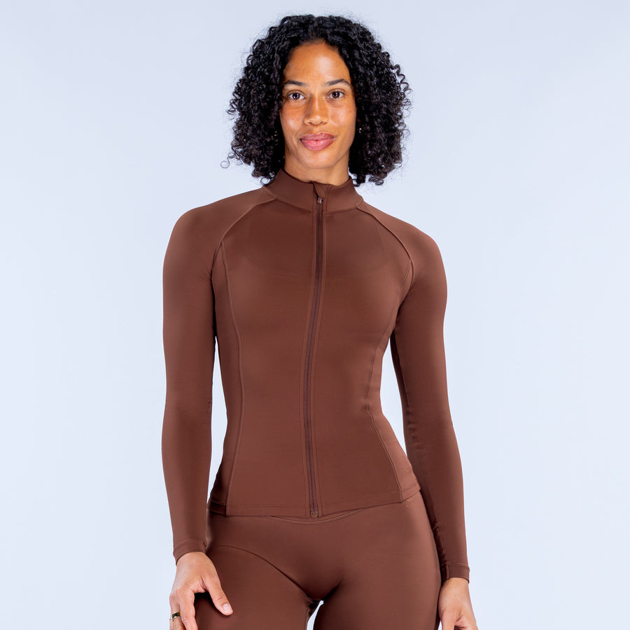 Brown zip-front athletic bodysuit with long sleeves and front zipper, front view