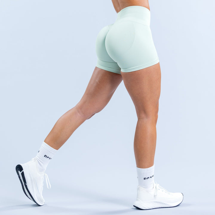 Mint green 4.5-inch high-rise athletic shorts, rear view