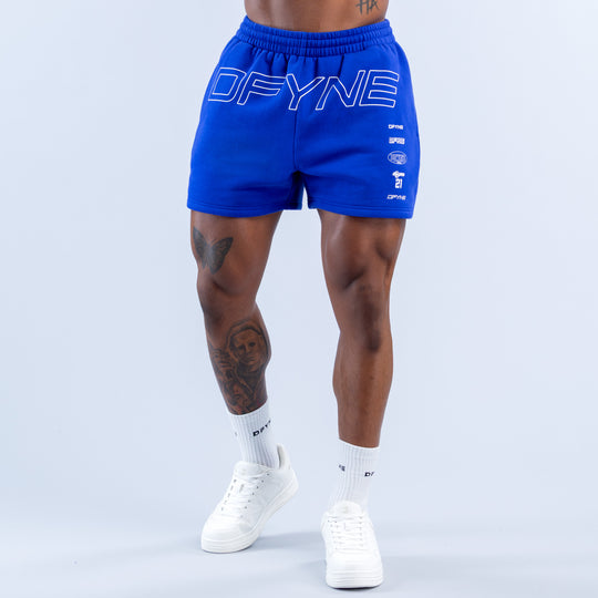 Blue jogger shorts with elastic waistband and large DFYNE logo on front