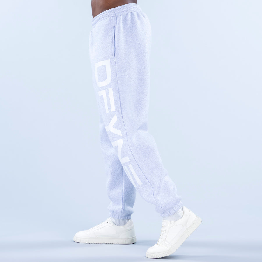 Light blue heather jogger pants with elastic cuffed hem and side seam pockets, logo print