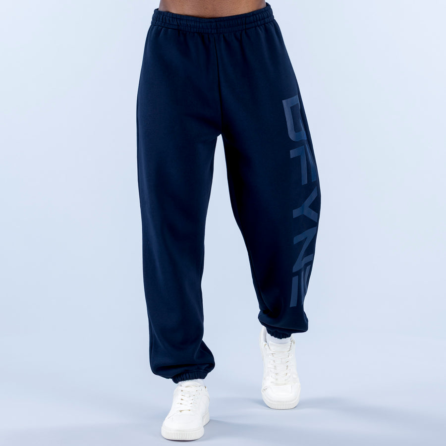 Navy cuffed joggers with elastic waistband and full-length side graphic print