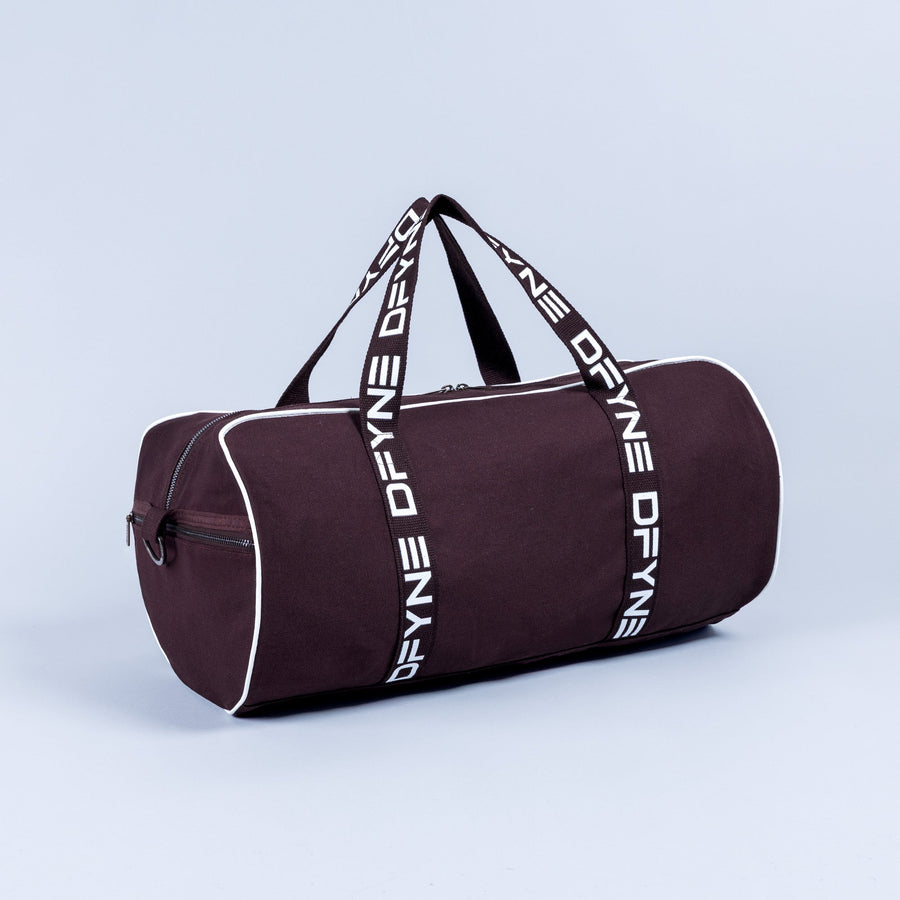 Burgundy duffle bag with white logo webbing straps and front zipper