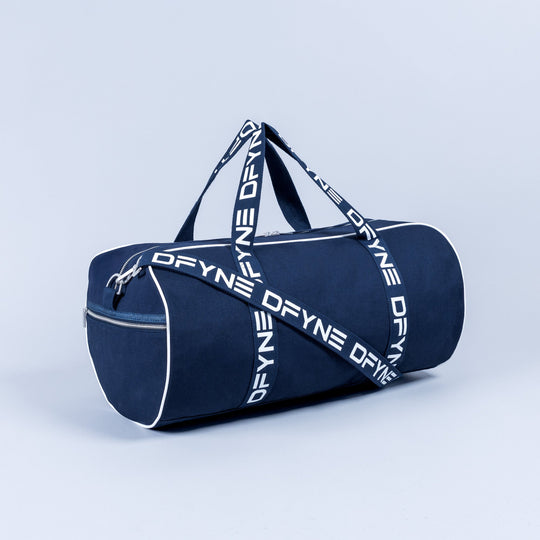 Navy duffle bag with top handle, crossbody strap, and white logo lettering