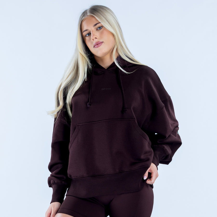 Dark maroon hoodie with drawstring hood and kangaroo pocket, front view