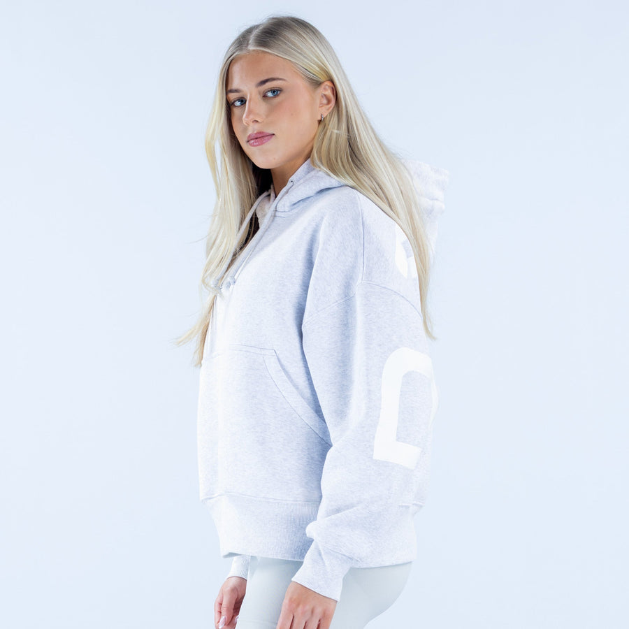 Light blue pullover hoodie, long sleeves, white logo detail at cuff