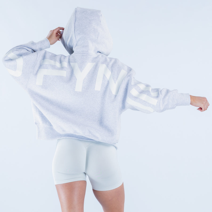 Light blue hoodie with hood and kangaroo pocket, drawstring and wide sleeves