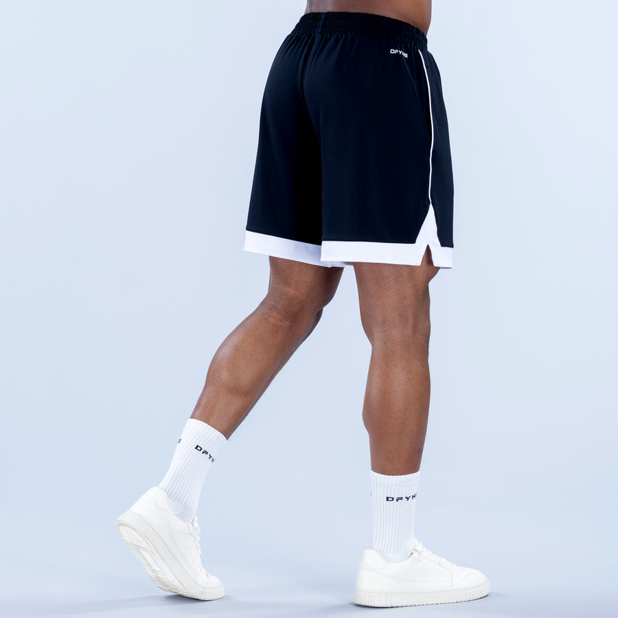 Navy jersey shorts with elastic waistband and white contrast hem with side slit