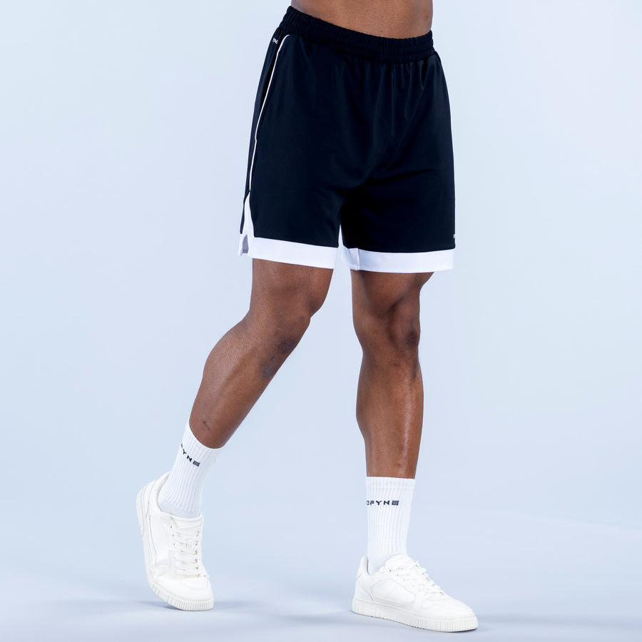 Navy jersey shorts with elastic waistband, drawstring ties, and white hem