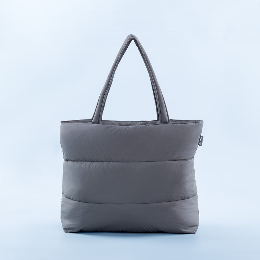 Quilted puffer tote bag with top handles, dark gray padded front panel