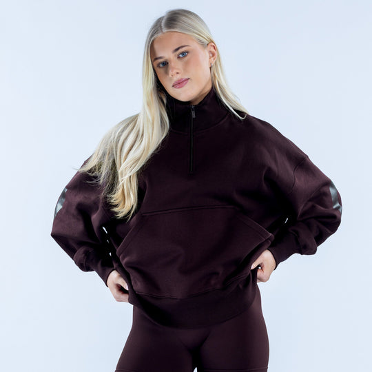 Dark plum quarter-zip sweatshirt with zip collar and front kangaroo pocket