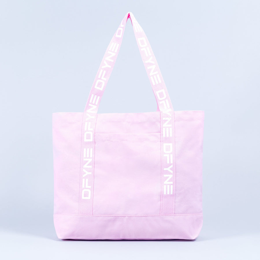 Light pink tote bag with wide handles and vertical logo tape on each side.