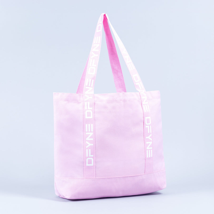 Light pink tote bag with logo handle tape and front panel seam detail.