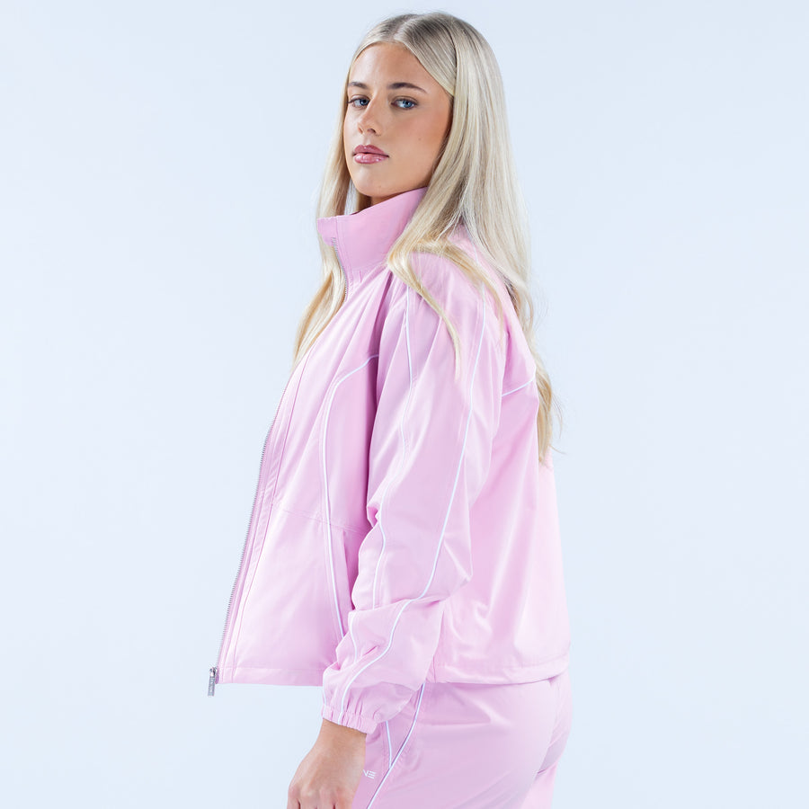 Pink track jacket side view with stand collar and elastic cuffs