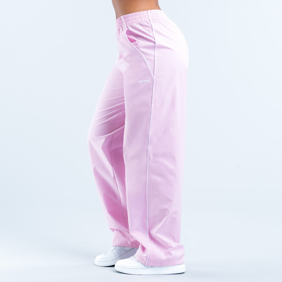 Light pink track pants with elastic waistband and side seam details