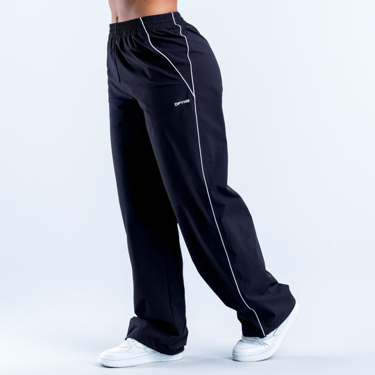 Black track pants with white piping stripe, elastic waist, logo on thigh