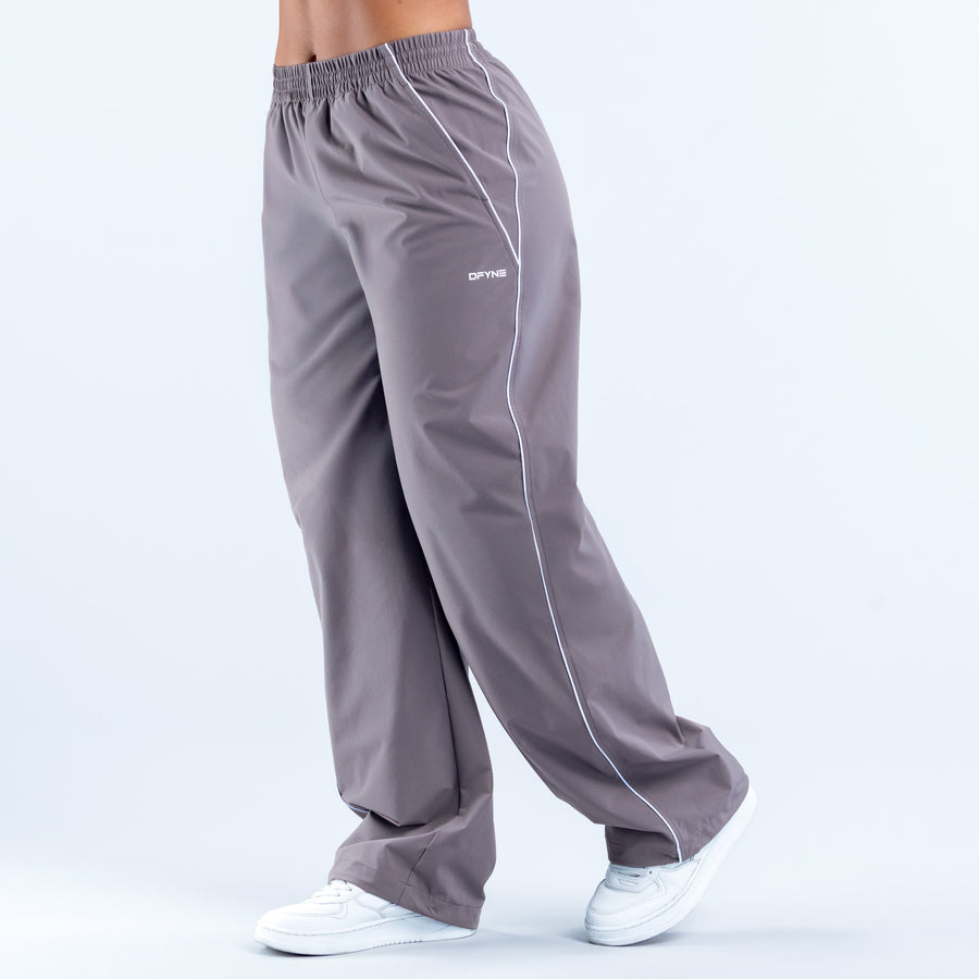 Gray track pants with white side piping, elastic waistband and cuffs