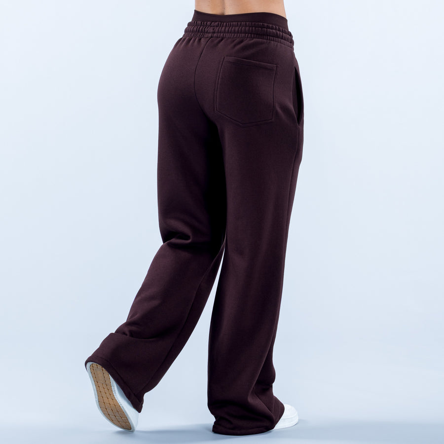 Wide-leg jogger pants in dark plum, elastic waistband, back pocket detail, cuffed hems