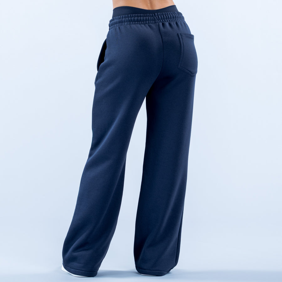 Navy wide-leg jogger pants with elastic waistband and side pockets, full length