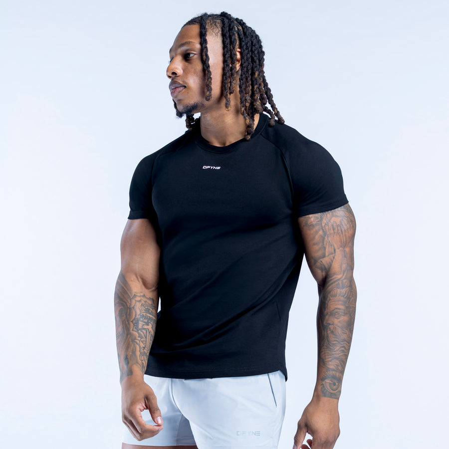Black T-shirt with crew neck and short sleeves, side view