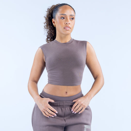Gray sleeveless crew-neck crop baby tee, front view with cropped hem