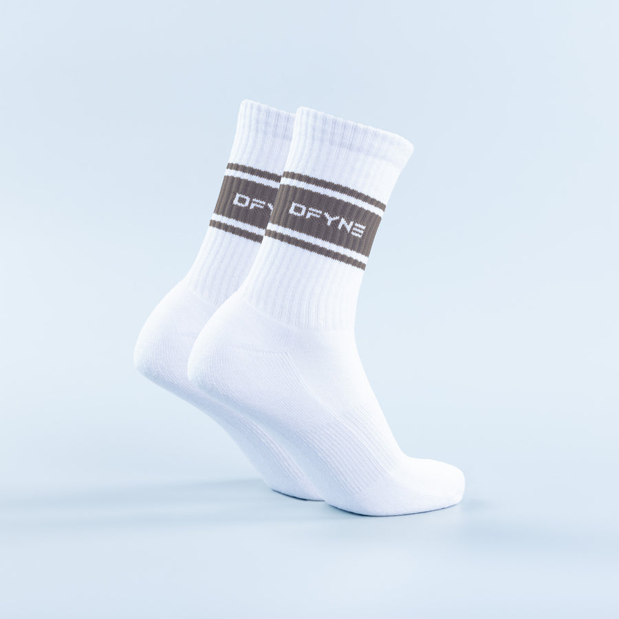 White crew socks with dark brown horizontal stripe and logo band at the cuff