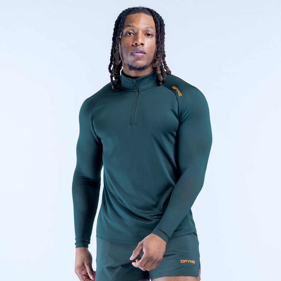 Teal long-sleeve quarter-zip athletic top with half-zip collar
