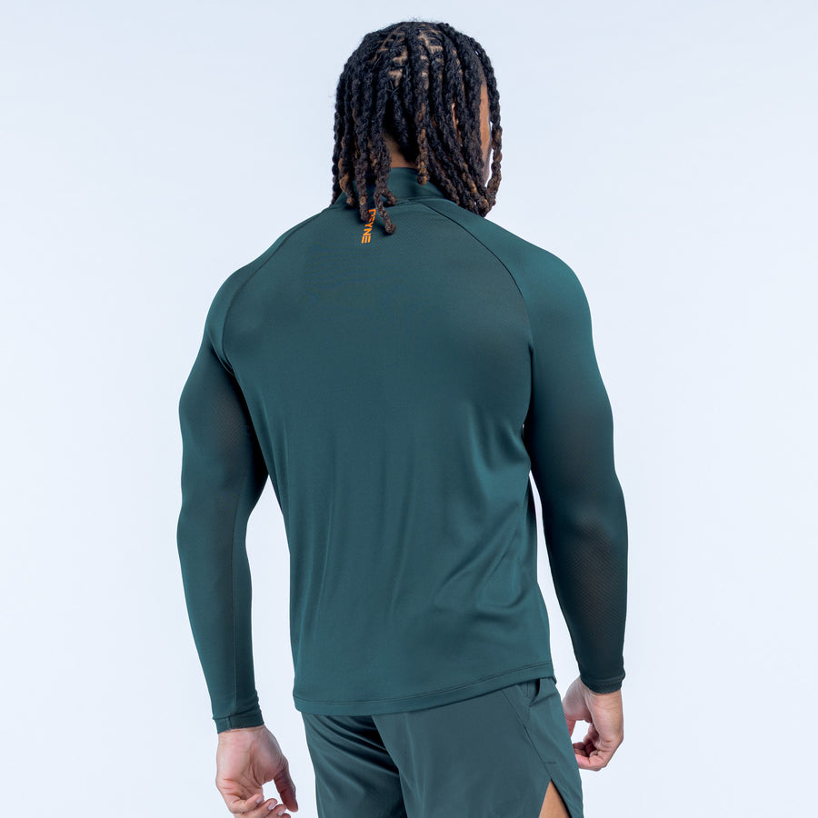 Teal quarter-zip athletic top, back yoke and long sleeves