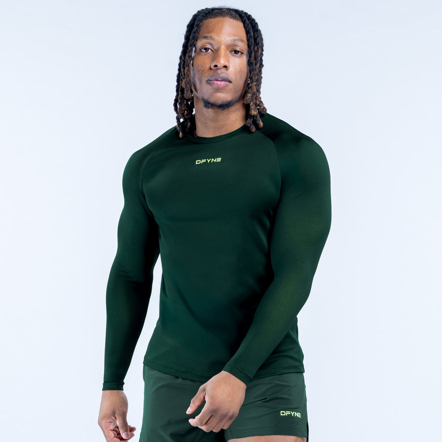 Men's long-sleeve training T-shirt in dark green, front view, crew neck, fitted with logo