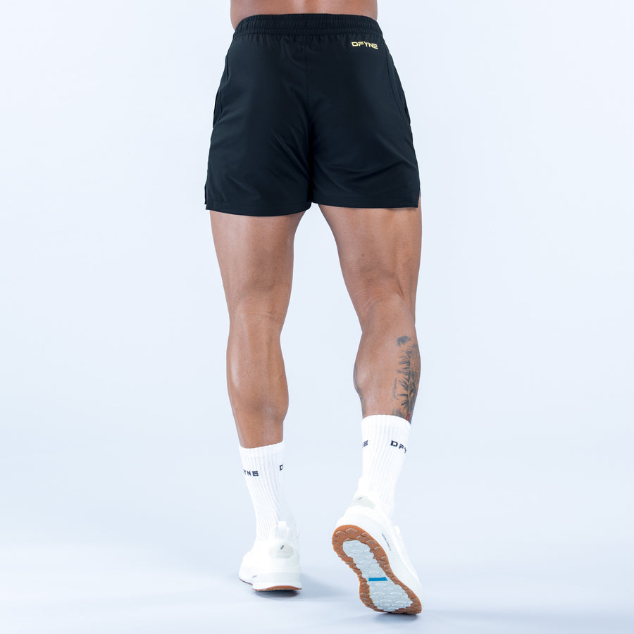 Training shorts back view with elastic waistband and small side logo