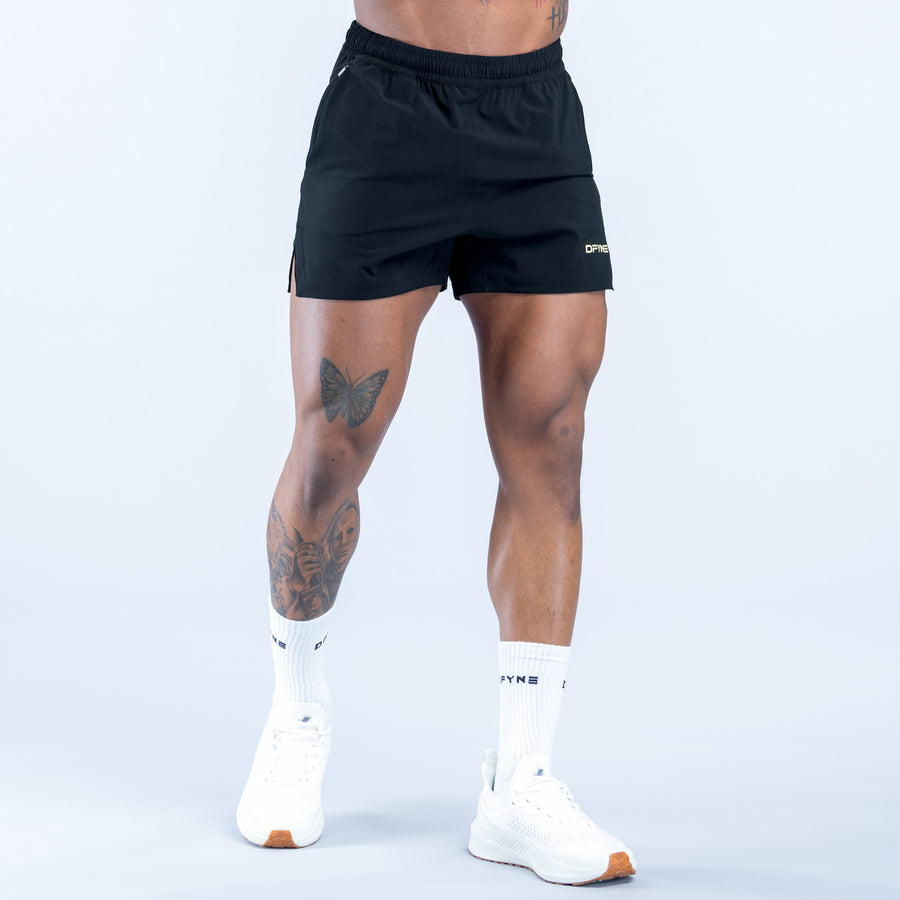 Training shorts front view with elastic waistband and side logo detail