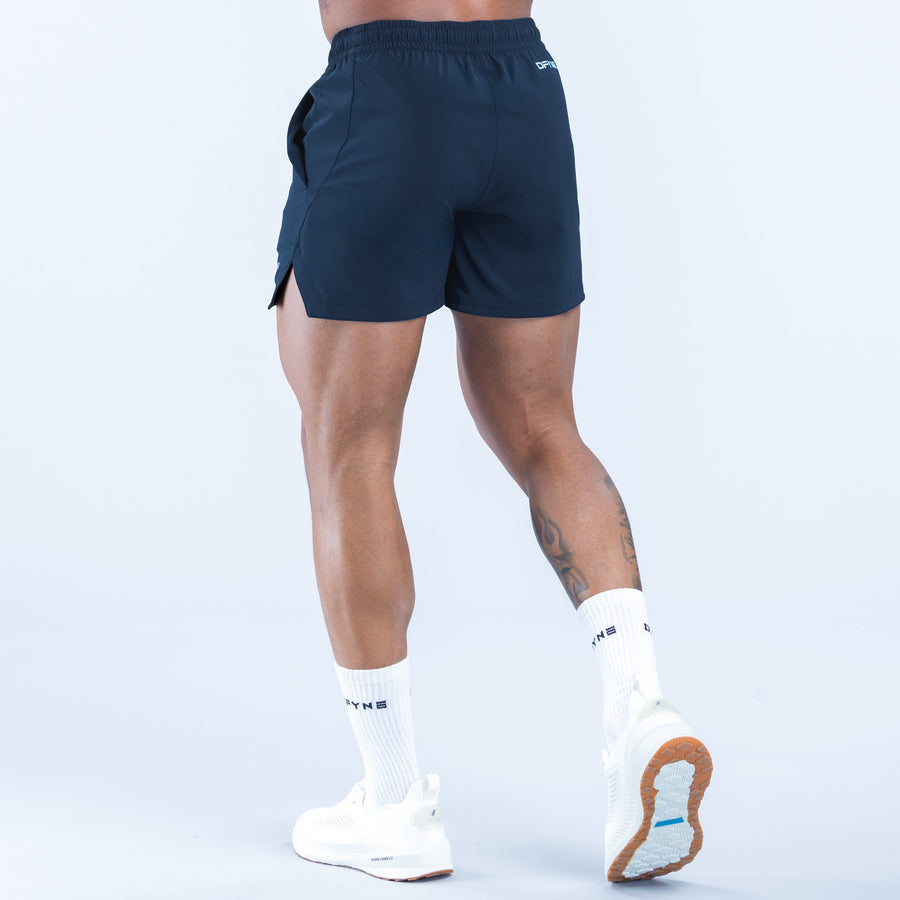 Navy training shorts with side pocket and elastic waistband, angled view